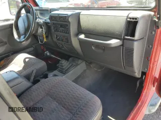 1999 Jeep Wrangler Sport with VIN 1J4FY19S7XP401120, listed as a Copart auction lot 64233665 with 129,708 mi miles and Salvage title. Bid and sale history available at DreamBid. Image 8.
