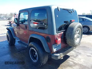 2003 Jeep Wrangler Sport with VIN 1J4FA49S33P345192, listed as a IAAI auction lot 41801344 with 196,472 mi miles. Bid and sale history available at carsss.com. Image 3.
