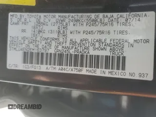 2014 Toyota Tacoma with VIN 3TMLU4EN2EM163797, listed as a Copart auction lot 61078805 with 130,748 mi miles and Salvage title. Bid and sale history available at DreamBid. Image 13.