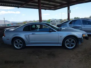 2001 Ford Mustang GT Deluxe z VIN 1FAFP42X11F210649, wystawiony jako IAAI lot #42052467 z przebiegiem 140 675 mil mil oraz . Historia ofert i sprzedaży dostępna na DreamBid. Obrazek 14.