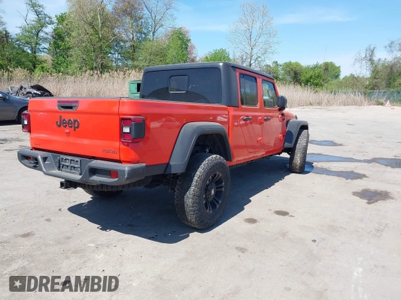 2020 Jeep Gladiator Sport S z VIN 1C6HJTAG0LL149161, wystawiony jako IAAI lot #42071132 z przebiegiem 153 062 mil mil oraz . Historia ofert i sprzedaży dostępna na DreamBid. Obrazek 4.