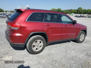 2014 Jeep Grand Cherokee Laredo with VIN 1C4RJEAG7EC274573, listed as a Copart auction lot 52637255 with 156,409 mi miles and Salvage Title. Bid and sale history available at DreamBid. Image 3.
