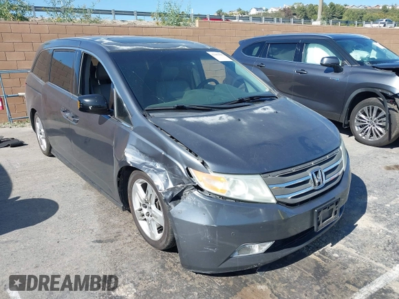 2011 Honda Odyssey Touring with VIN 5FNRL5H96BB009580, listed as a IAAI auction lot 42202595 with Not provided miles and . Bid and sale history available at DreamBid. Image 1.