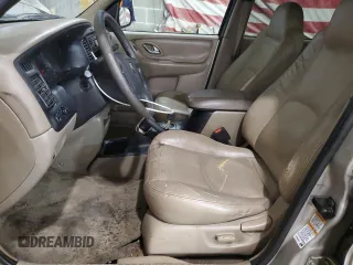 2001 Mazda Tribute LX with VIN 4F2CU08101KM05943, listed as a Copart auction lot 84077694 with 137,937 mi miles and Salvage Title. Bid and sale history available at DreamBid. Image 7.