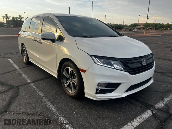 2019 Honda Odyssey Touring z VIN 5FNRL6H86KB053432, wystawiony jako Copart lot #65482425 z przebiegiem 87 470 mil mil oraz Szkoda całkowita • Salvage title. Historia ofert i sprzedaży dostępna na DreamBid. Obrazek 1.