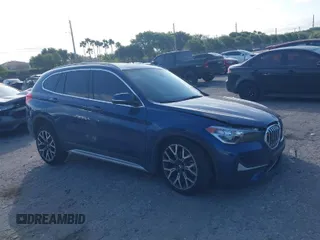 2021 BMW X1 sDrive28i with VIN WBXJG7C00M5S20495, listed as a IAAI auction lot 41608492 with 32,412 mi miles. Bid and sale history available at carsss.com. Image 1.