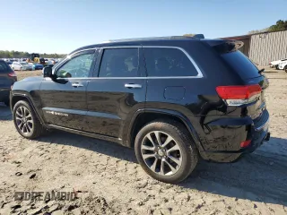 2017 Jeep Grand Cherokee Overland with VIN 1C4RJFCT3HC755960, listed as a Copart auction lot 52268895 with 99,998 mi miles and Salvage title. Bid and sale history available at DreamBid. Image 2.