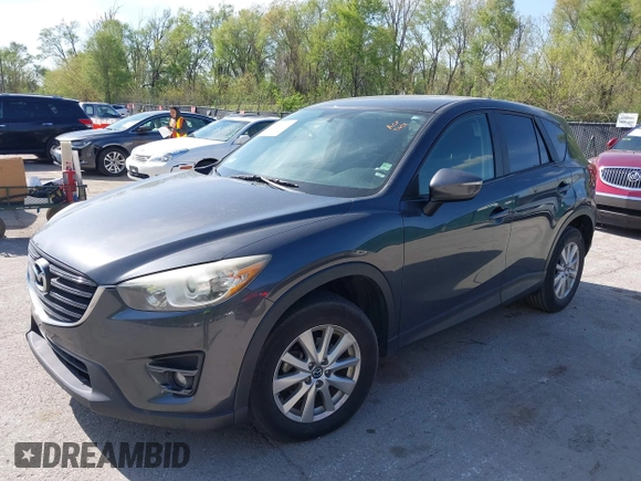 2016 Mazda CX-5 Touring z VIN JM3KE2CY4G0708972, wystawiony jako IAAI lot #42043013 z przebiegiem 157 573 mil mil oraz . Historia ofert i sprzedaży dostępna na DreamBid. Obrazek 17.