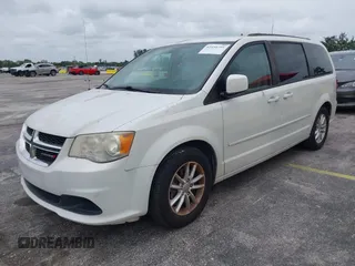 2014 Dodge Grand Caravan SXT z VIN 2C4RDGCGXER322705, wystawiony jako IAAI lot #42450791 z przebiegiem 147 113 mil mil oraz . Historia ofert i sprzedaży dostępna na DreamBid. Obrazek 2.