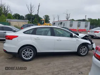 2018 Ford Focus SE z VIN 1FADP3F24JL247003, wystawiony jako IAAI lot #42531969 z przebiegiem 55 344 mil mil oraz . Historia ofert i sprzedaży dostępna na DreamBid. Obrazek 13.