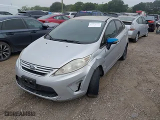 2013 Ford Fiesta SE with VIN 3FADP4BJXDM220183, listed as a IAAI auction lot 42026592 with 153,396 mi miles. Bid and sale history available at carsss.com. Image 2.