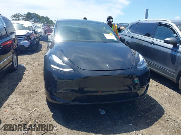 2022 Tesla Model Y Long Range z VIN 7SAYGDEE4NA006645, wystawiony jako IAAI lot #42192495 z przebiegiem 28 784 mil mil oraz . Historia ofert i sprzedaży dostępna na DreamBid. Obrazek 12.