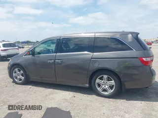 2012 Honda Odyssey Touring with VIN 5FNRL5H90CB088536, listed as a IAAI auction lot 42102008 with 283,350 mi miles and . Bid and sale history available at DreamBid. Image 14.