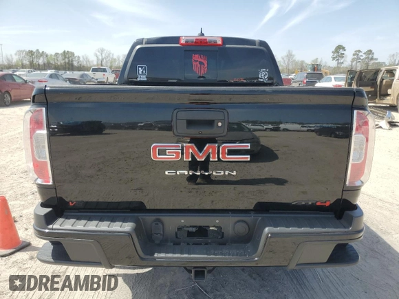2021 GMC Canyon 4WD AT4 w/Leather with VIN 1GTG6FEN3M1274409, listed as a Copart auction lot 49228145 with 57,194 mi miles and Salvage Title. Bid and sale history available at carsss.com. Image 6.