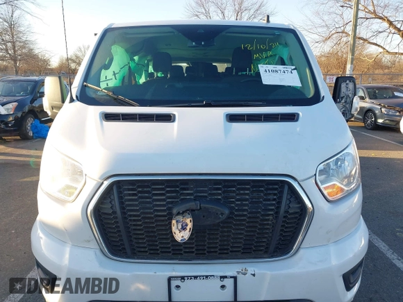2021 Ford Transit Passenger XL with VIN 1FBAX2Y87MKA64167, listed as a IAAI auction lot 41087474 with 67,242 mi miles and . Bid and sale history available at DreamBid. Image 12.