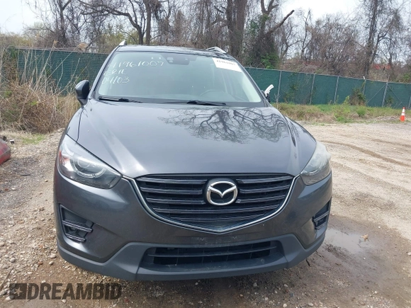 2016 Mazda CX-5 Grand Touring with VIN JM3KE4DYXG0830150, listed as a IAAI auction lot 41961007 with 142,570 mi miles and . Bid and sale history available at DreamBid. Image 12.