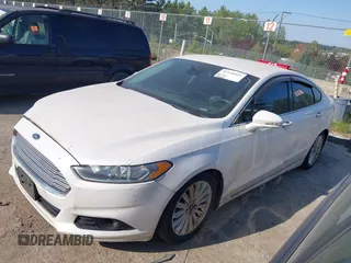 2016 Ford Fusion Titanium Hybrid with VIN 3FA6P0RU2GR357739, listed as a IAAI auction lot 42120441 with 151,201 mi miles. Bid and sale history available at carsss.com. Image 17.