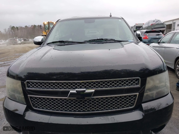 2011 Chevrolet Suburban LTZ with VIN 1GNSCKE02BR206544, listed as a IAAI auction lot 41159341 with 218,202 mi miles. Bid and sale history available at carsss.com. Image 12.