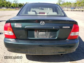 1999 Mazda Protege DX with VIN JM1BJ2223X0139775, listed as a Copart auction lot 54338455 with 63,198 mi miles and Salvage Title. Bid and sale history available at DreamBid. Image 6.