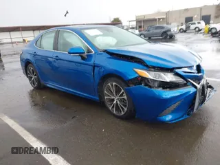 2019 Toyota Camry LE z VIN 4T1B11HK1KU282870, wystawiony jako IAAI lot #41799625 z przebiegiem 63 977 mil mil oraz . Historia ofert i sprzedaży dostępna na DreamBid. Obrazek 1.