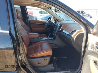 2013 Jeep Grand Cherokee Overland with VIN 1C4RJFCT1DC654653, listed as a IAAI auction lot 41826619 with 124,283 mi miles. Bid and sale history available at carsss.com. Image 5.