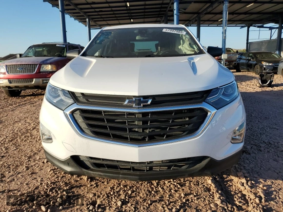 2020 Chevrolet Equinox LS z VIN 2GNAXHEV3L6149833, wystawiony jako Copart lot #57997985 z przebiegiem 64 304 mil mil oraz Szkoda całkowita • Salvage title. Historia ofert i sprzedaży dostępna na DreamBid. Obrazek 5.