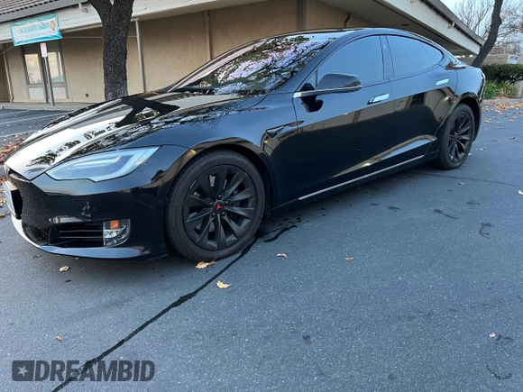2017 Tesla Model S 60 with VIN 5YJSA1E15HF219286, listed as a Copart auction lot 84771024 with 43,259 mi miles and Salvage title. Bid and sale history available at DreamBid. Image 2.