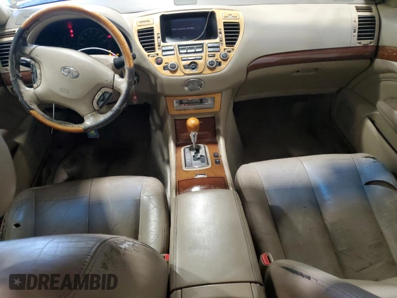 2002 Infiniti Q45 z VIN JNKBF01A62M002926, wystawiony jako Copart lot #73206924 z przebiegiem Nie podano mil oraz Szkoda całkowita • Salvage title. Historia ofert i sprzedaży dostępna na DreamBid. Obrazek 8.