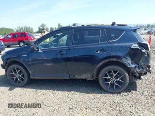 2018 Toyota RAV4 Hybrid SE with VIN JTMJJREV9JD191552, listed as a IAAI auction lot 42158665 with 84,025 mi miles and . Bid and sale history available at DreamBid. Image 14.