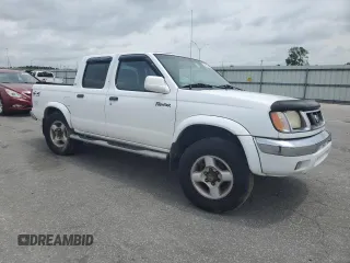 2000 Nissan Frontier XE with VIN 1N6ED27Y6YC334154, listed as a Copart auction lot 54140454 with 330,552 mi miles and Salvage title. Bid and sale history available at DreamBid. Image 4.