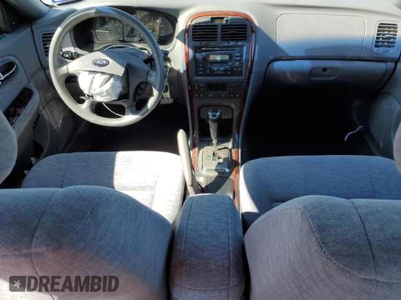2005 Kia Optima LX z VIN KNAGD128055433689, wystawiony jako Copart lot #46909305 z przebiegiem 27 609 mil mil oraz Szkoda całkowita • Salvage title. Historia ofert i sprzedaży dostępna na DreamBid. Obrazek 8.