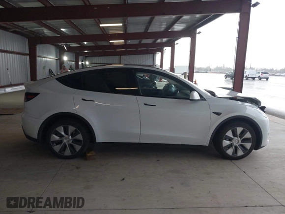 2023 Tesla Model Y Long Range z VIN 7SAYGDEE2PF834036, wystawiony jako IAAI lot #41933120 z przebiegiem 27 872 mil mil oraz . Historia ofert i sprzedaży dostępna na DreamBid. Obrazek 14.