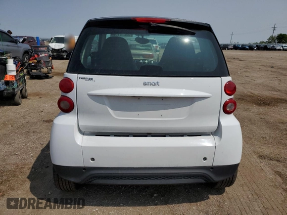 2014 Smart fortwo Pure z VIN WMEEJ3BA5EK779399, wystawiony jako Copart lot #59279785 z przebiegiem 117 204 mil mil oraz Czysty tytuł • Clean title. Historia ofert i sprzedaży dostępna na DreamBid. Obrazek 6.