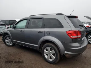 2013 Dodge Journey American Value with VIN 3C4PDCABXDT578099, listed as a Copart auction lot 48867795 with 187,338 mi miles and Salvage title. Bid and sale history available at DreamBid. Image 2.