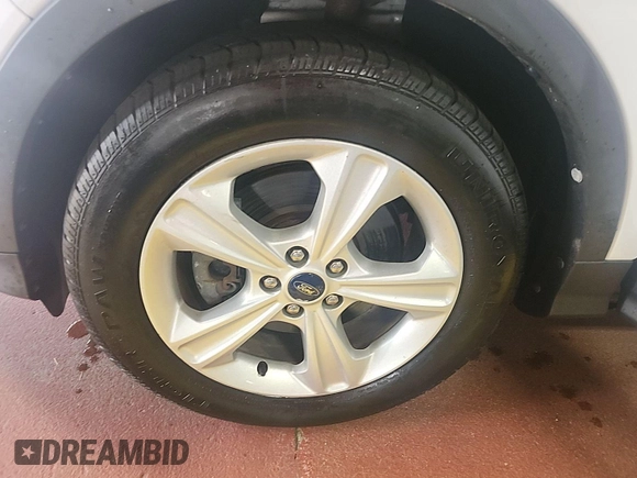 2014 Ford Escape SE z VIN 1FMCU9GX7EUC02600, wystawiony jako IAAI lot #42570755 z przebiegiem 86 871 mil mil oraz . Historia ofert i sprzedaży dostępna na DreamBid. Obrazek 34.