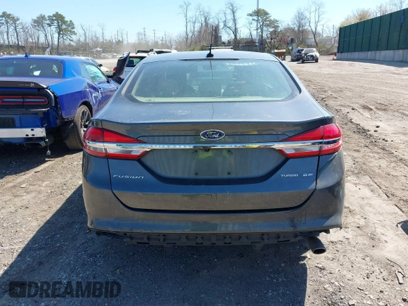 2018 Ford Fusion SE z VIN 3FA6P0H74JR233829, wystawiony jako IAAI lot #42049766 z przebiegiem 120 370 mil mil oraz . Historia ofert i sprzedaży dostępna na DreamBid. Obrazek 16.
