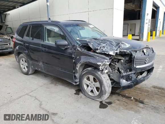 2009 Suzuki Grand Vitara with VIN JS3TE044094100649, listed as a Copart auction lot 52033855 with 137,460 mi miles and Salvage title. Bid and sale history available at DreamBid. Image 4.