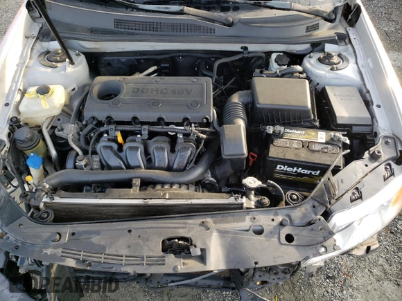 2009 Kia Optima LX z VIN KNAGE228195332931, wystawiony jako Copart lot #55279665 z przebiegiem 295 523 mil mil oraz Szkoda całkowita • Salvage title. Historia ofert i sprzedaży dostępna na DreamBid. Obrazek 11.