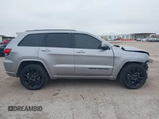 2019 Jeep Grand Cherokee Laredo E with VIN 1C4RJFAG9KC670974, listed as a IAAI auction lot 42333028 with 163,958 mi miles and . Bid and sale history available at DreamBid. Image 14.