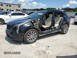 2021 Cadillac XT4 AWD Sport z VIN 1GYFZFR43MF054379, wystawiony jako Copart lot #55338315 z przebiegiem 53 693 mil mil oraz Szkoda całkowita • Salvage title. Historia ofert i sprzedaży dostępna na DreamBid. Obrazek 1.