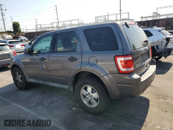 2011 Ford Escape XLS with VIN 1FMCU0C79BKC12943, listed as a Copart auction lot 64702085 with 151,117 mi miles and Clean title. Bid and sale history available at DreamBid. Image 2.