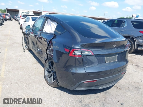 2024 Tesla Model Y with VIN 7SAYGDED9RA321373, listed as a IAAI auction lot 42228491 with 6,452 mi miles and . Bid and sale history available at DreamBid. Image 3.