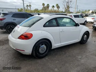 2012 Volkswagen Beetle 2.5L w/Sun/Sound/Nav PZEV with VIN 3VWHP7AT0CM651997, listed as a Copart auction lot 79121014 with 45,560 mi miles and Salvage Title. Bid and sale history available at carsss.com. Image 3.
