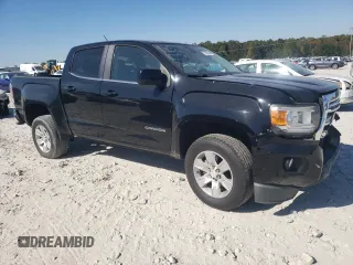 2015 GMC Canyon 2WD SLE with VIN 1GTG5BEA6F1221120, listed as a Copart auction lot 77391484 with 180,334 mi miles and Salvage Title. Bid and sale history available at carsss.com. Image 4.