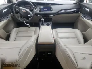 2023 Cadillac XT4 FWD Luxury with VIN 1GYAZAR45PF218684, listed as a Copart auction lot 54427565 with 74,920 mi miles and Salvage Title. Bid and sale history available at carsss.com. Image 8.