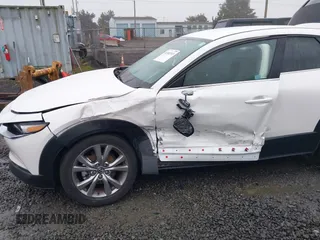 2021 Mazda CX-30 Select with VIN 3MVDMBBL3MM205256, listed as a IAAI auction lot 41302313 with 17,709 mi miles and . Bid and sale history available at DreamBid. Image 6.