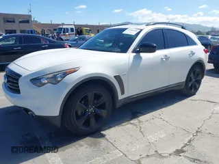 2015 Infiniti QX70 with VIN JN8CS1MU5FM380792, listed as a IAAI auction lot 41946084 with 128,928 mi miles and . Bid and sale history available at DreamBid. Image 2.
