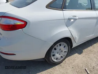 2014 Ford Fiesta S z VIN 3FADP4AJXEM211776, wystawiony jako IAAI lot #42574815 z przebiegiem 174 043 mil mil oraz . Historia ofert i sprzedaży dostępna na DreamBid. Obrazek 6.