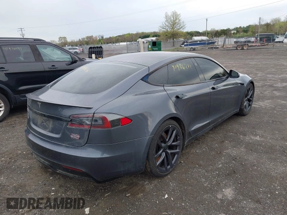 2021 Tesla Model S Long Range with VIN 5YJSA1E5XMF428519, listed as a IAAI auction lot 41926242 with 54,284 mi miles and . Bid and sale history available at DreamBid. Image 4.