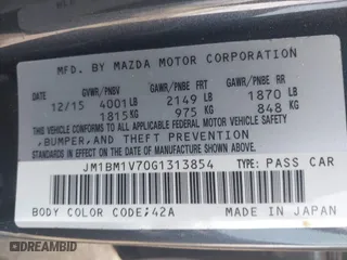 2016 Mazda Mazda3 i Touring with VIN JM1BM1V70G1313854, listed as a IAAI auction lot 41957601 with 144,128 mi miles. Bid and sale history available at carsss.com. Image 9.